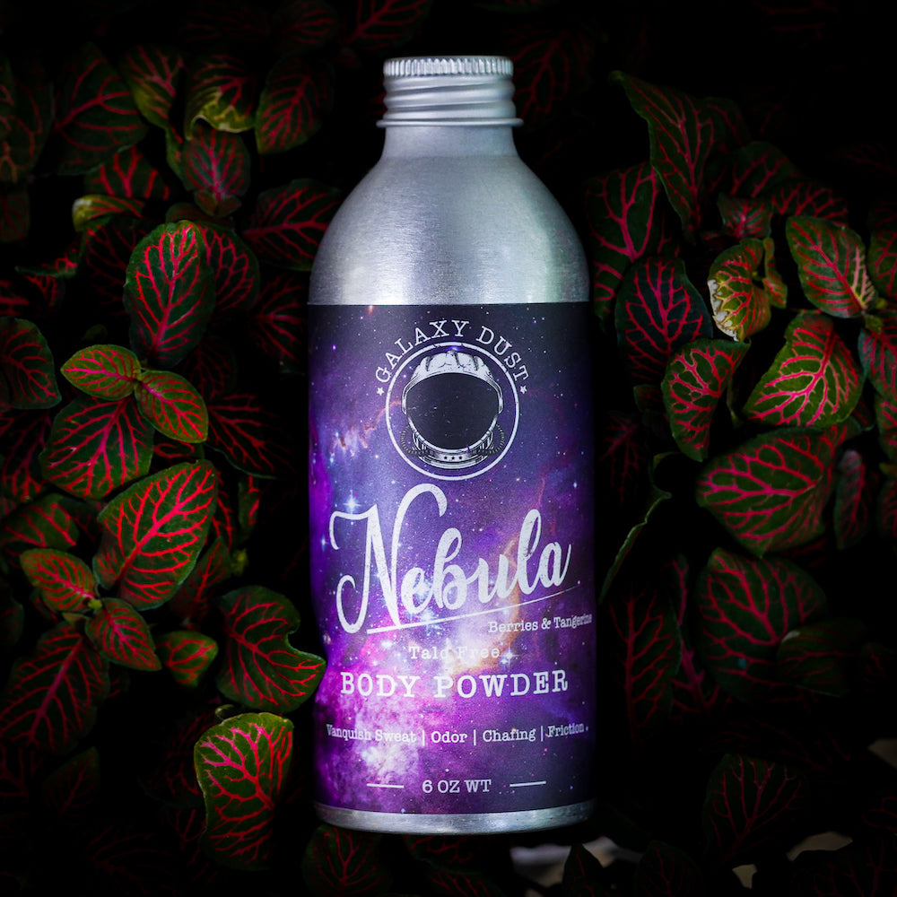 A bottle of Nebula body powder for women